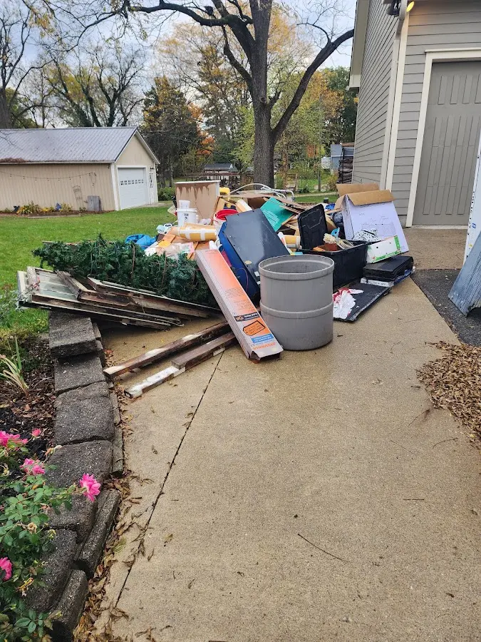 Dumpster being loaded with debris for Demolition Dumpster Rental in Marlboro Village